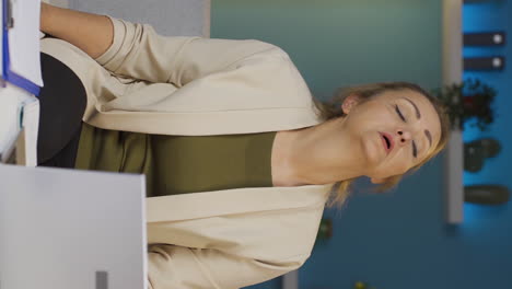 Vertical-video-of-Home-office-worker-woman-has-fatigue.